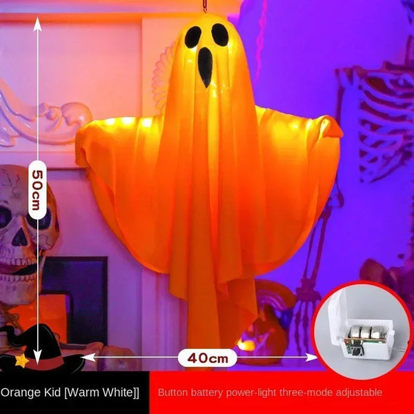 Light-Up Hanging Ghosts – orange sheet ghost glowing, about 50 cm tall and 40 cm wide, with its button-battery box