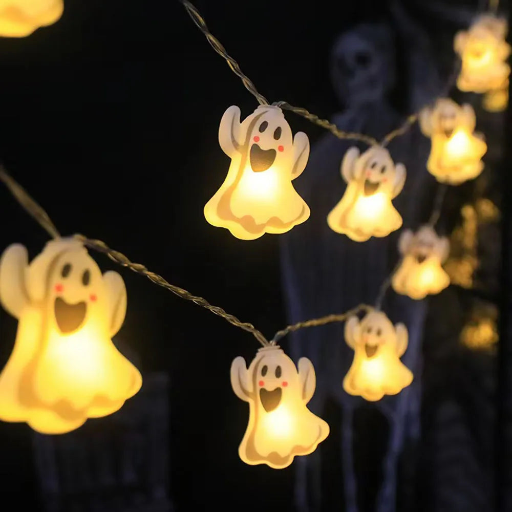 Halloween String Lights – glowing ghost charms hanging in the dark