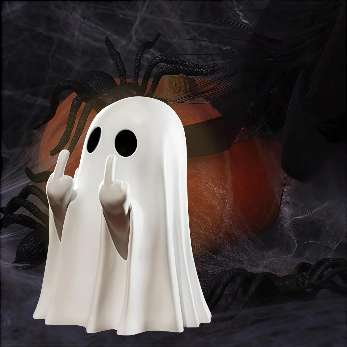 Middle Finger Ghost Figurine – white ghost in front of a pumpkin and cobwebs