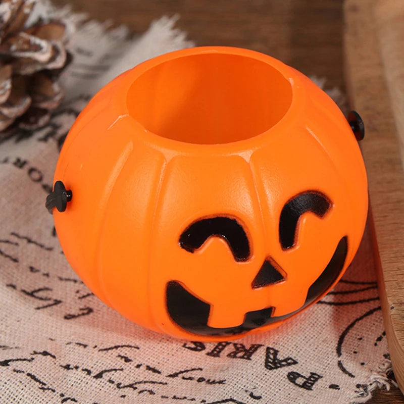 Jack-O'-Lantern Pumpkin Candy Bucket – close-up of an open-top bucket showing the inside and the handle mount