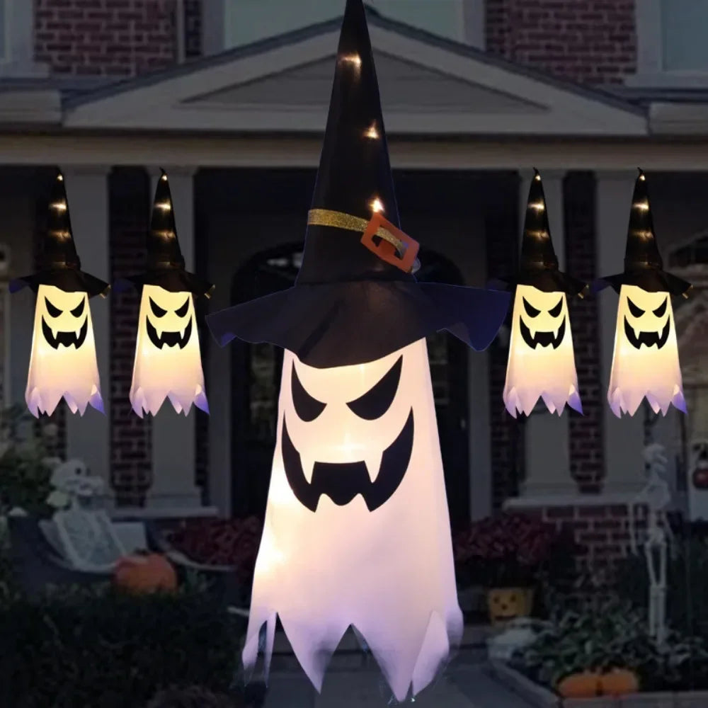 Light-Up Hanging Ghosts – warm white witch hat ghosts hanging on a porch