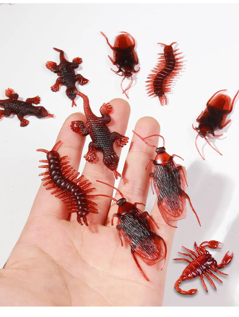 Fake Bugs Prank Pack – hand holding a fake gecko, centipede, scorpion and cockroaches