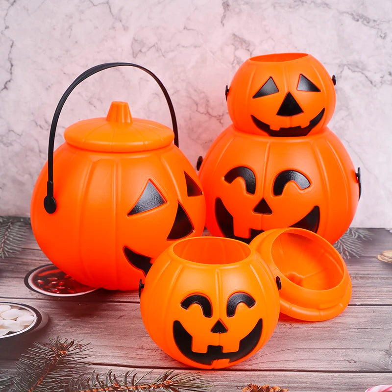 Jack-O'-Lantern Pumpkin Candy Bucket – four pumpkin buckets in two sizes, with and without lids, on a wooden table