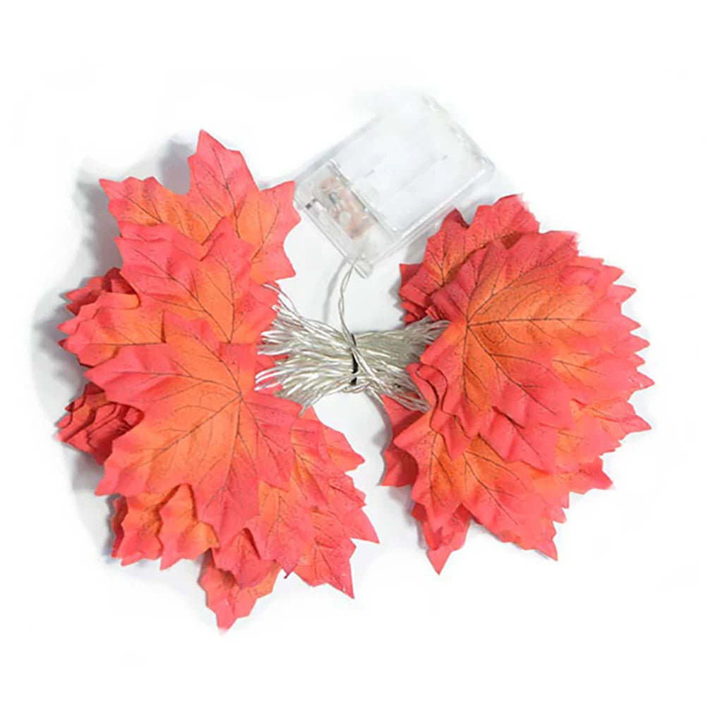 Maple Leaf LED Garland Lights – coiled unlit garland with a clear battery box on a white background