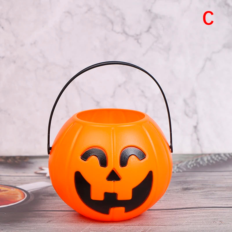 Jack-O'-Lantern Pumpkin Candy Bucket – small open-top bucket with a black handle and smiling face
