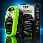 TGC Gear Oil Film Brush 2.0 Large Capacity 150ml oil cleaner kit, featuring a bright lime green brush head and its black retail packaging box on a reflective dark blue background.